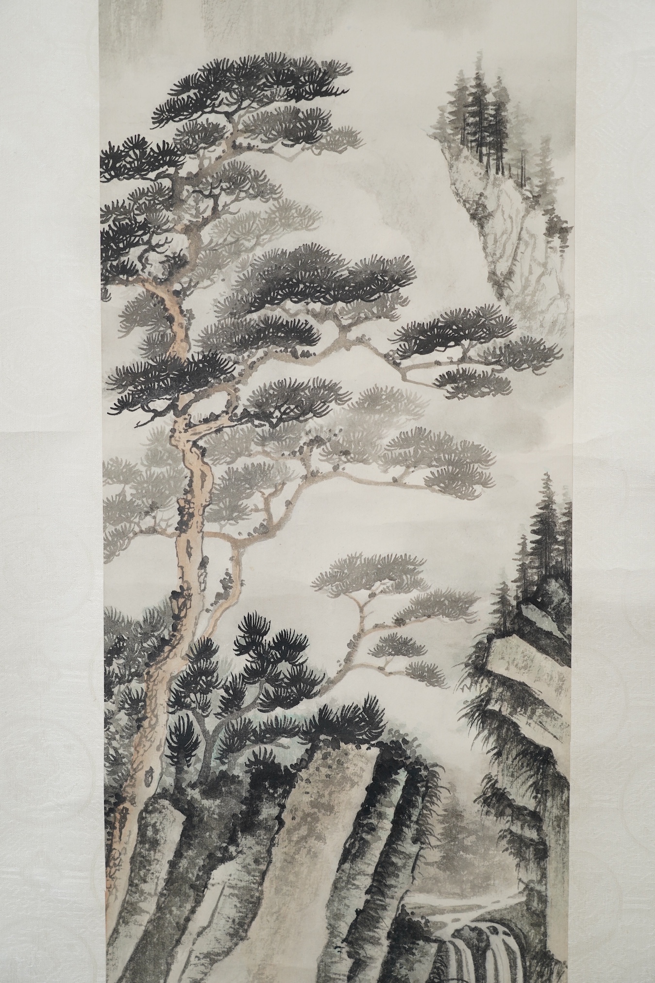 Manner of Huang Junbi, 20th/21st century, a set of four scroll paintings on paper of mountainous landscapes, boxed. Condition - fair to good